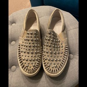 Silver studded sneakers.